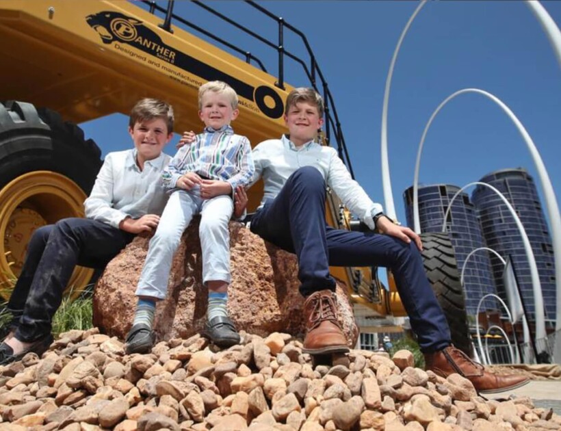 Thomas, 9, James, 5, and Harry Piacentini, 11, in front of the Panther II Series Low Loader
